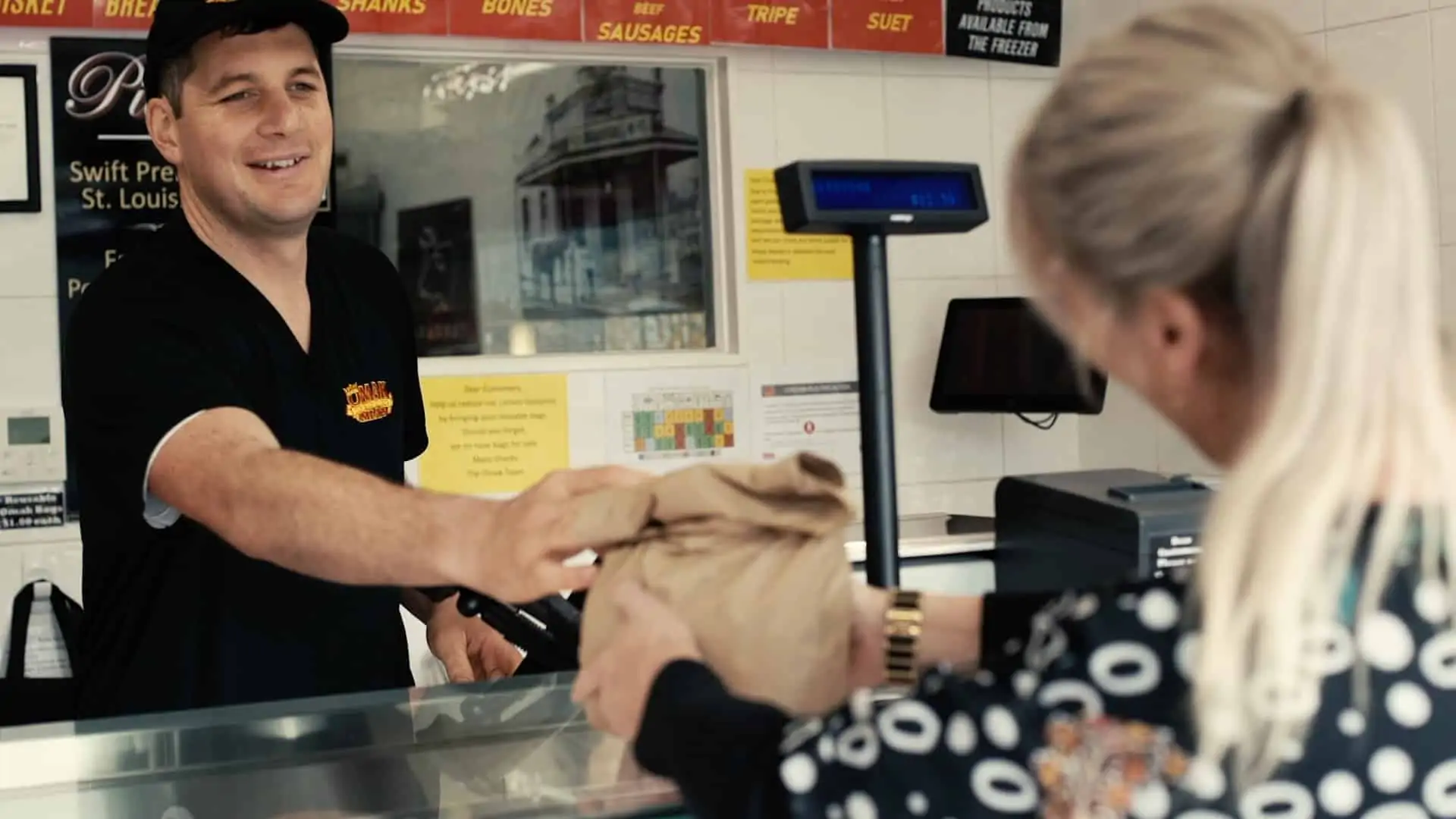 Omak Meats staff serving a customer